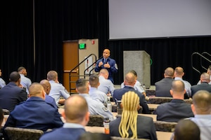 Photo of Chief Master Sergeant Israel Nuñez speaking during recruiting training event