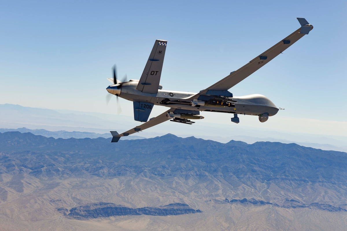 An MQ-9 Reaper fires a Hellfire Missile.