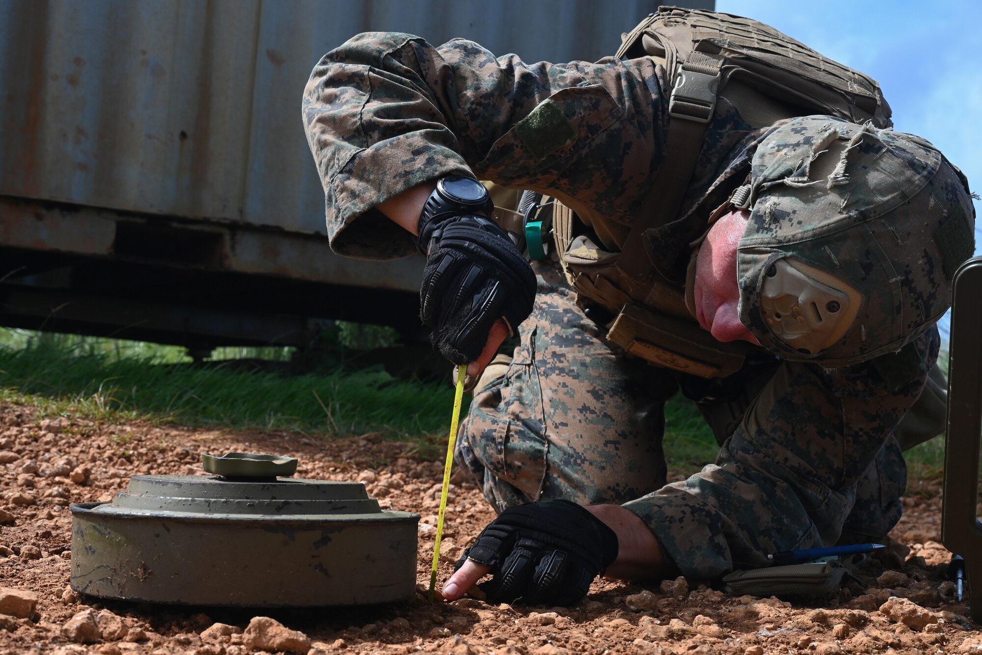U.S. Marine Corps Gunnery Sgt. Nicholas Raetz, headquarters battalion explosive ordinance operations chief assigned to Camp Blaz, Guam, measures a simulated explosive device during a joint EOD training at Andersen Air Force Base, Guam, Nov. 8, 2023.