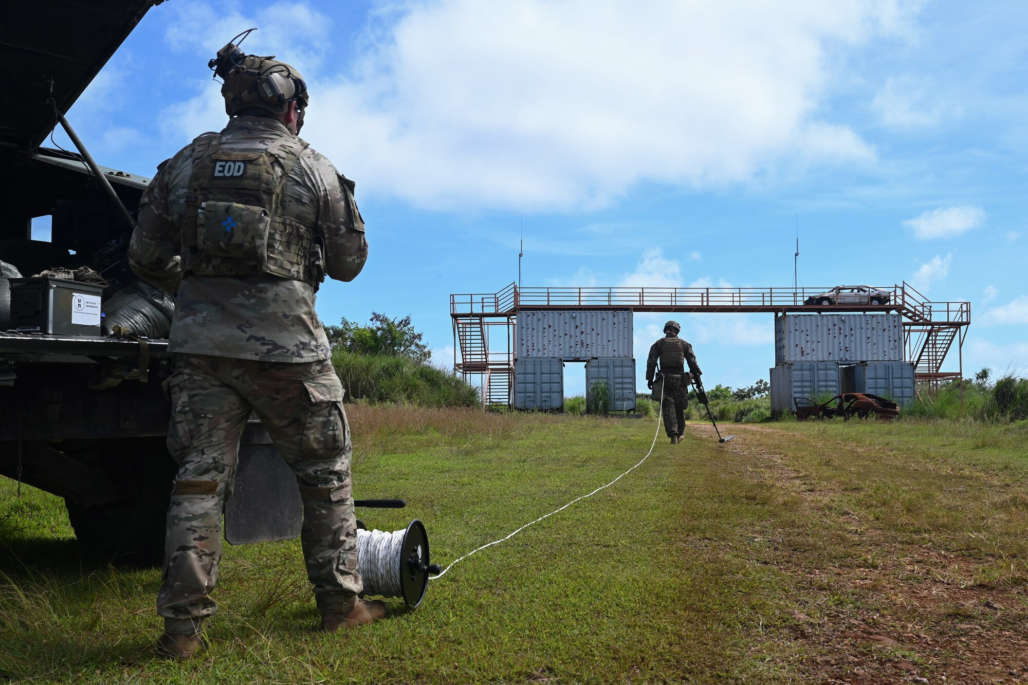 A U.S. Air Force airman and a U.S. Marine Corps marine during a joint explosive ordinance training at Andersen Air Force Base, Guam, Nov. 8, 2023.