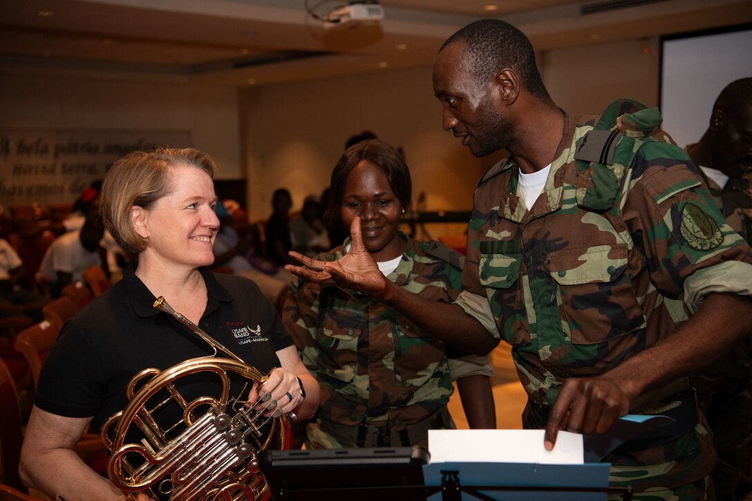 U.S. Air Force Tech. Sgt. Libby Barnette, left, assigned to the U.S. Air Forces in Europe and Air Forces Africa (USAFE-AFAFRICA) Band’s 5 Star Brass, and Angolan Armed Forces Lt. John Thomas, assigned to Angolan Armed Forces Band, talk during a rehearsal at the Dr. Antonio Agostinho Neto Memorial in Luanda, Angola, Nov. 7, 2023. The USAFE-AFAFRICA Band’s tour to Angola embodies the U.S. Air Forces Africa’s dedication to strengthening cultural ties and enriching the partnerships between the U.S. and Angola through music. (U. S Department of Defense photo by Mass Communication Specialist 2nd Class Michael Hogan)