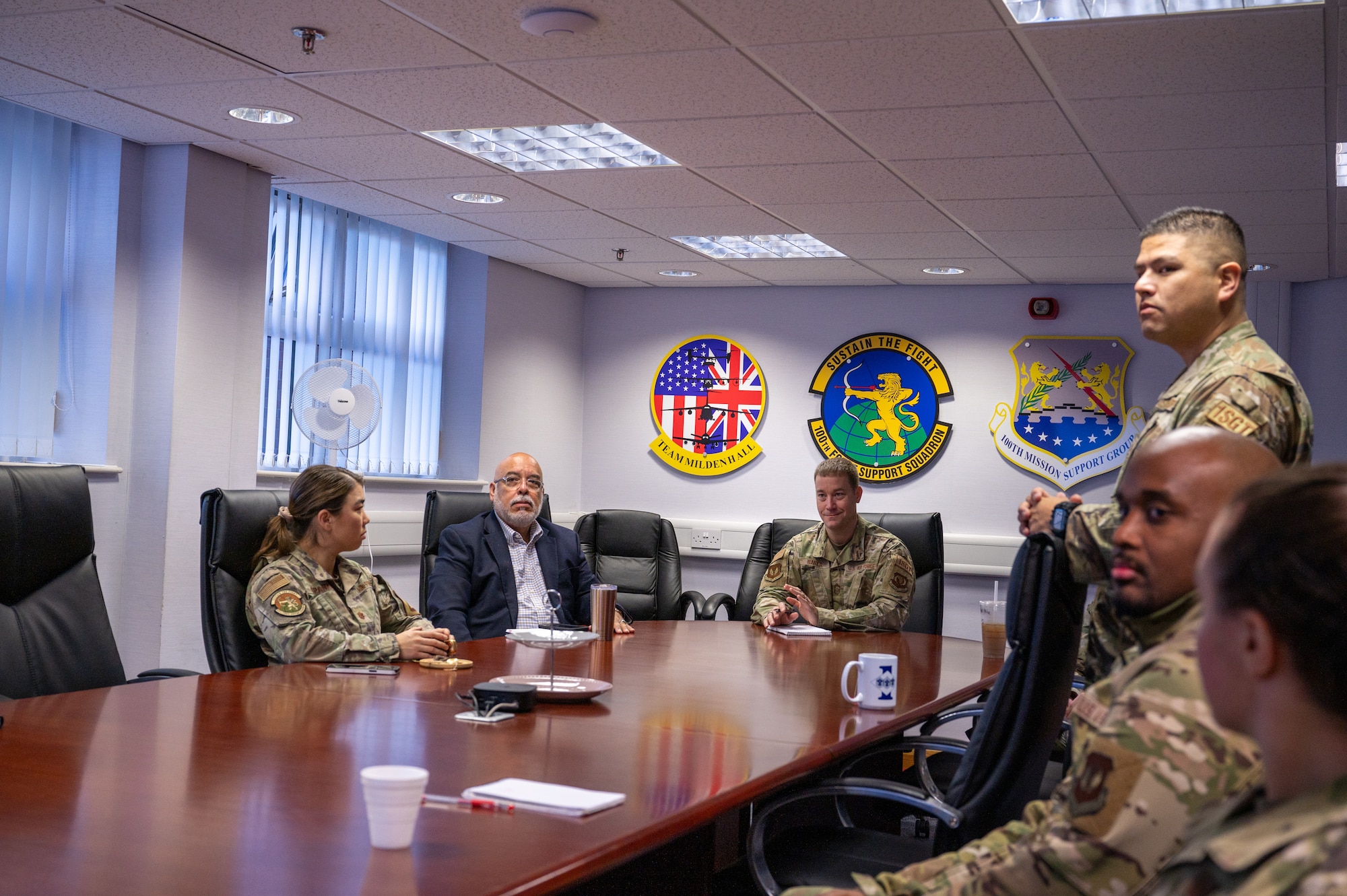 U.S. Air Force Chief Master Sgt. George Baker, center, U.S. Air Forces in Europe - Air Forces Africa command first sergeant, meets with 100th Force Support Squadron personnel at Royal Air Force Mildenhall, England, Nov. 15, 2023.