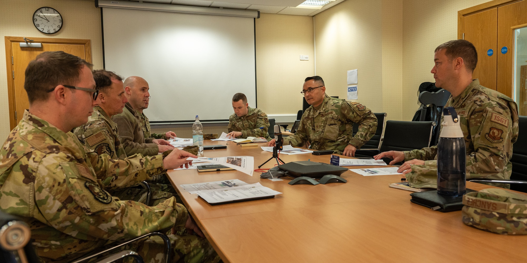 U.S. Air Force Chief Master Sgt. George Baker, right, U.S. Air Forces in Europe - Air Forces Africa command first sergeant, meets with 100th Civil Engineer Squadron personnel at Royal Air Force Mildenhall, England, Nov. 15, 2023.