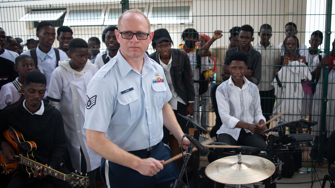 U.S. Air Force Staff Sgt. Dan Dyar, assigned to the U.S. Air Forces in Europe and Air Forces Africa (USAFE-AFAFRICA) Band’s Five Star Brass, performs alongside students from the Polytechnic Institute of Art in Kilamba, Angola, Nov. 9, 2023. The USAFE-AFAFRICA Band’s tour to Angola embodies the U.S. Air Forces Africa’s dedication to strengthening cultural ties and enriching the partnerships between the U.S. and Angola through music. (U.S. Department of Defense photo by Mass Communication Specialist 2nd Class Michael Hogan)