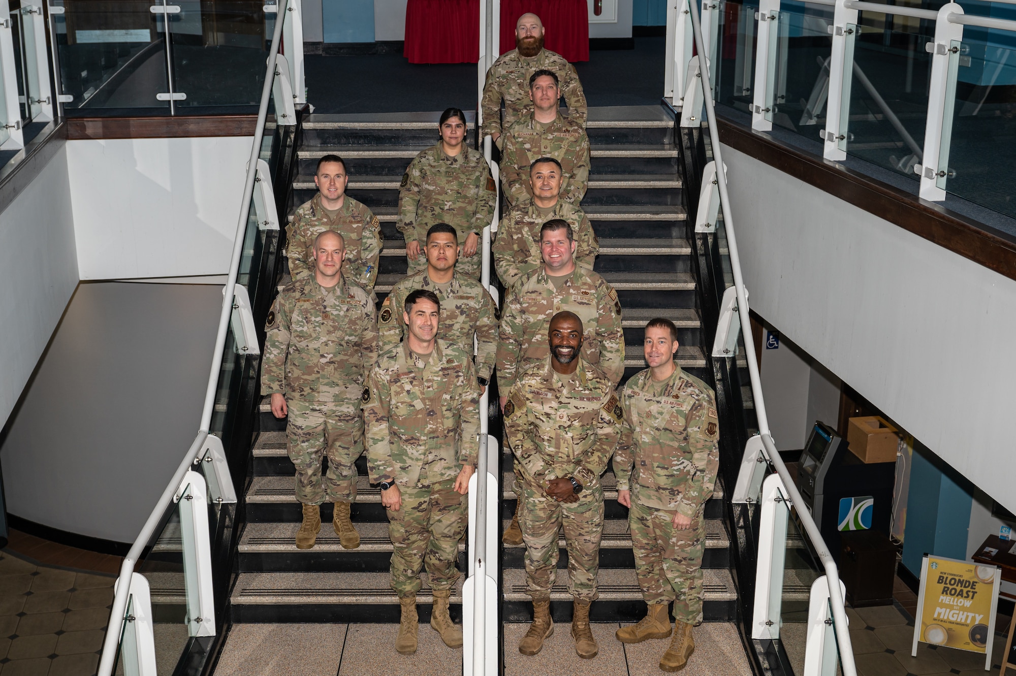 U.S. Air Force Chief Master Sgt. George Baker, bottom right, U.S. Air Forces in Europe - Air Forces Africa command first sergeant, poses for a photo with first sergeants at Royal Air Force Mildenhall, England, Nov. 15, 2023.