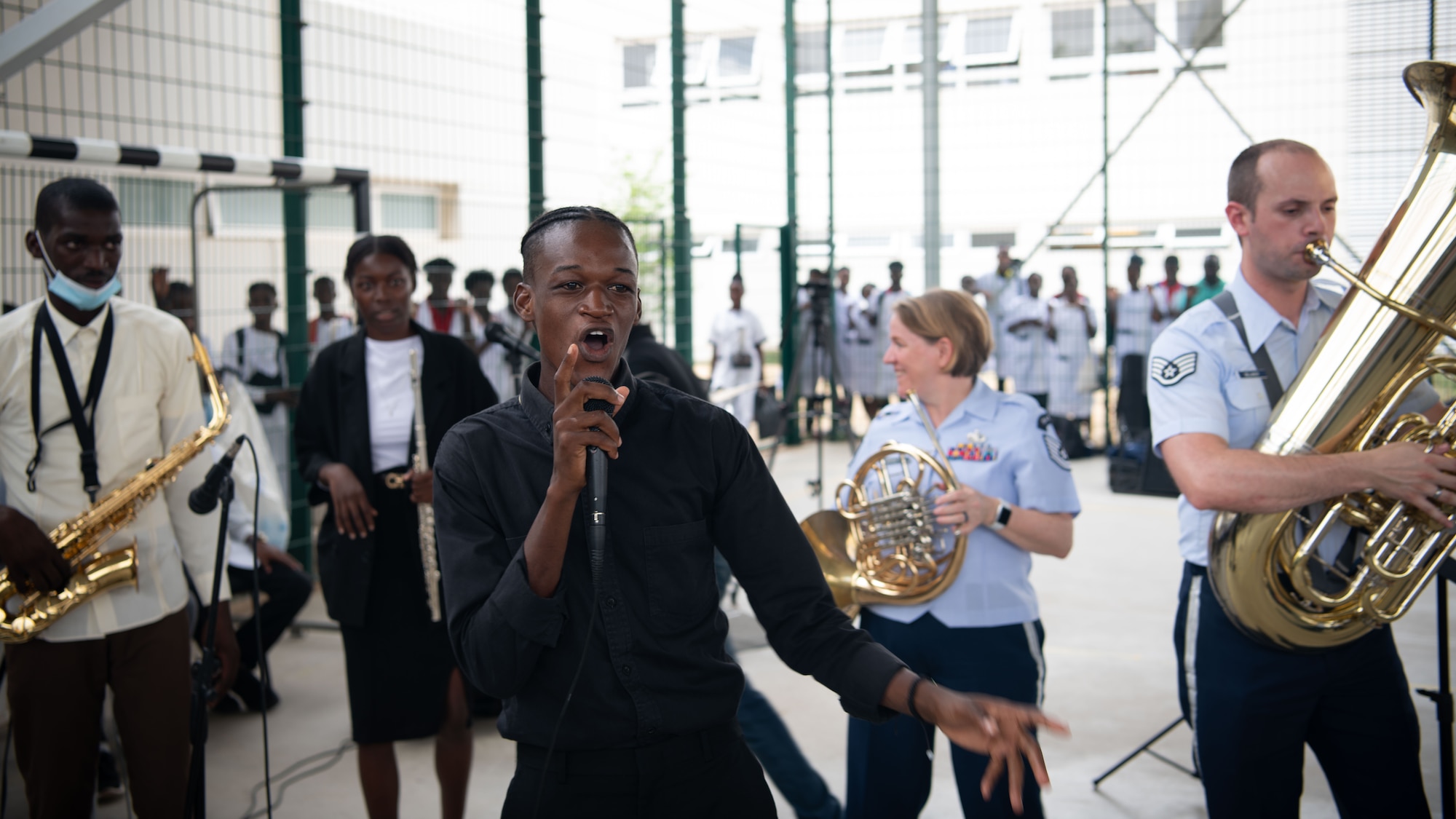 U.S. Airmen with the USAFE-AFAFRICA Band’s perform alongside students from the Polytechnic Institute of Art in Kilamba, Angola.