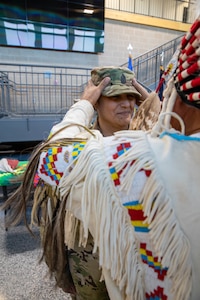 Elizabeth “Promise” Crawford was promoted to the rank of sergeant major in the South Dakota Army National Guard by Larry Wetsit during a ceremony at Joint Force Headquarters on Camp Rapid, Rapid City, S.D., Nov. 9, 2023. She is the first female Native American sergeant major in the SDNG.