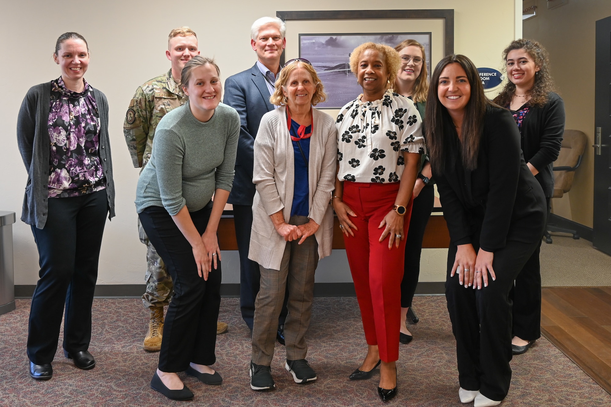 Judges, participants and hosts pose for a photo after the completion of the 2023 Air Force Sustainment Center Bot Rodeo