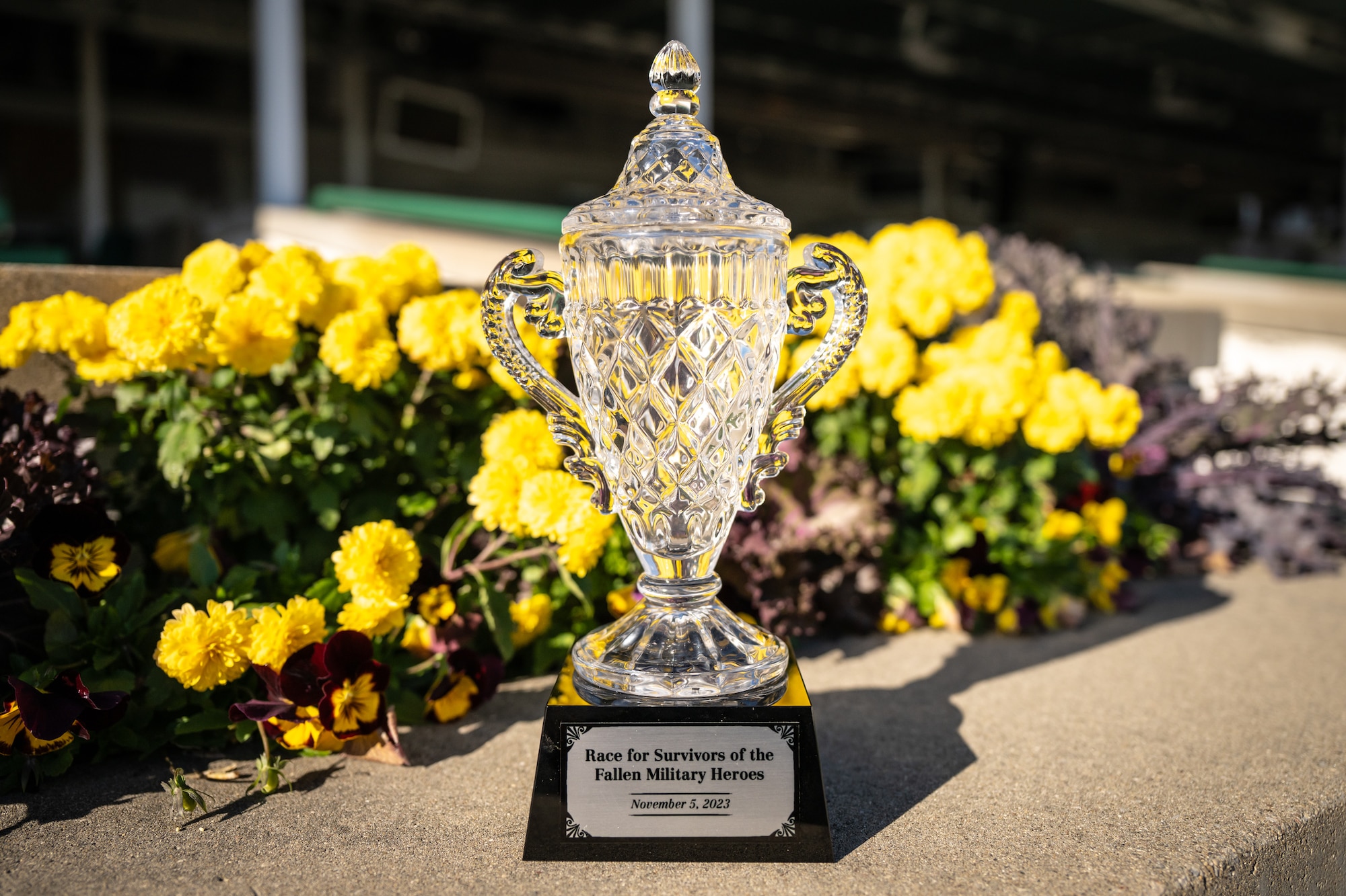 Halina’s Forte, a 2-year-old filly ridden by Jockey Martin Garcia, earned this trophy with a victory in the 5th race at Churchill Downs Racetrack in Louisville, Ky., Nov. 5, 2023. The 5 1/2-furlong maiden contest, dubbed the Race for Survivors of the Fallen Military Heroes, was held in honor of family members who've lost loved ones in service to the United States. It was part of Survivor’s Day at the Races, an annual event hosted with assistance from the Kentucky National Guard that drew more than 700 family members from 18 states. (U.S. Air National Guard photo by Dale Greer)