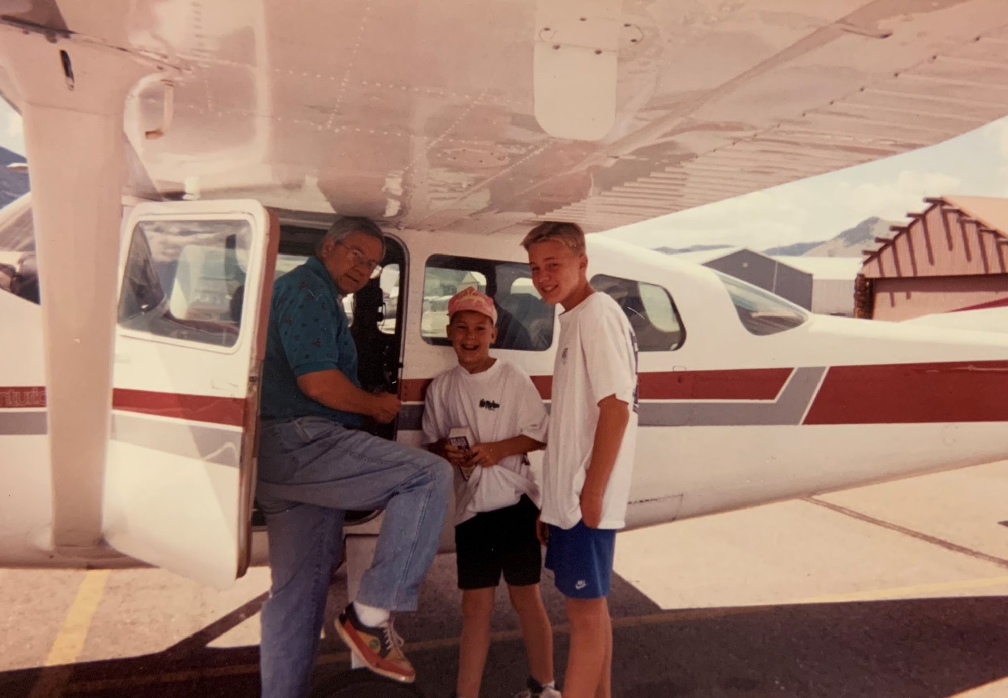 Col. Nicolas Henschel is shown in this family photo with his father and brother at their airplane.