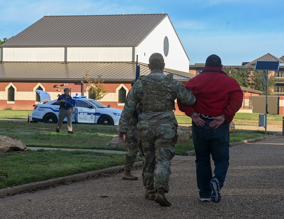 U.S. Air Force Senior Airman Brandon Anderson, 17th Security Forces Squadron Defender, detains a simulated perpetrator during an exercise at Goodfellow Air Force Base, Texas, Nov. 16, 2023. The drill was conducted to test and enhance the response capabilities of the base in the event of a real-world threat. (U.S. Air Force photo by Airman 1st Class Zach Heimbuch)