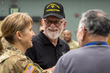 U.S. Army veteran Sam Pierce talks with Brig. Gen. Paige M. Jennings, U.S. Army Financial Management Command commanding general, and another veteran during the reactivation of his old unit, the 45th Finance Center, during a ceremony at the Maj. Gen. Emmett J. Bean Federal Center in Indianapolis Nov. 6, 2023. Pierce served in the Army from 1972-1982 and maintains a Facebook group page for 45th Finance Section veterans to stay connected. (U.S. Army photo by Mark R. W. Orders-Woempner)