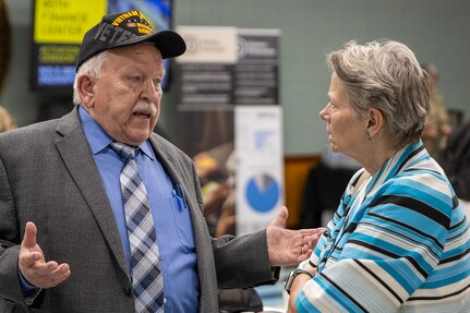 Caral Spangler, Assistant Secretary of the Army for Financial Management and Comptroller, talks with retired U.S. Army 1st Sgt. James Curren during a ceremony reactivating the 45th Finance Center at the Maj. Gen. Emmett J. Bean Federal Center in Indianapolis Nov. 6, 2023. Curren, a Vietnam War veteran, served in the Army from 1964-1985 and in the 45th Finance Section from 1973-1977. (U.S. Army photo by Mark R. W. Orders-Woempner)