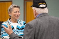 Caral Spangler, Assistant Secretary of the Army for Financial Management and Comptroller, talks with retired U.S. Army 1st Sgt. James Curren during a ceremony reactivating the 45th Finance Center at the Maj. Gen. Emmett J. Bean Federal Center in Indianapolis Nov. 6, 2023. Curren, a Vietnam War veteran, served in the Army from 1964-1985 and in the 45th Finance Section from 1973-1977. (U.S. Army photo by Mark R. W. Orders-Woempner)