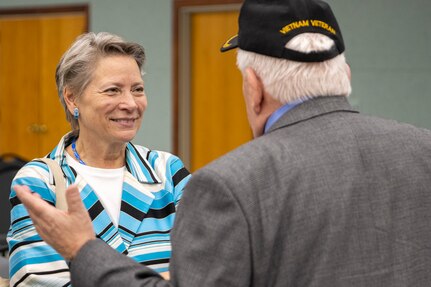 Caral Spangler, Assistant Secretary of the Army for Financial Management and Comptroller, talks with retired U.S. Army 1st Sgt. James Curren during a ceremony reactivating the 45th Finance Center at the Maj. Gen. Emmett J. Bean Federal Center in Indianapolis Nov. 6, 2023. Curren, a Vietnam War veteran, served in the Army from 1964-1985 and in the 45th Finance Section from 1973-1977. (U.S. Army photo by Mark R. W. Orders-Woempner)