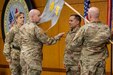 Lt. Col. Jason Shick, 45th Finance Center acting director, unfurls a 45th FC guidon as Brig. Gen. Paige M. Jennings, U.S. Army Financial Management Command commanding general; Master Sgt. Daniel Reyes Baerga, 45th FC acting senior enlisted advisor; and Sgt. 1st Class Jerrod Newman, USAFMCOM senior financial management systems instructor, look on during a ceremony reactivating the 45th FC at the Maj. Gen. Emmett J. Bean Federal Center in Indianapolis Nov. 6, 2023. As USAFMCOM’s operational arm and early deployer, the 45th FC is required to be ready to deploy at a moment’s notice to conduct theater preparation operations; provide timely procurement and theater disbursing support through the establishment of central funding operations; and enable joint, interagency, intergovernmental and multinational operations. (U.S. Army photo by Staff Sgt. Joshua Syberg)