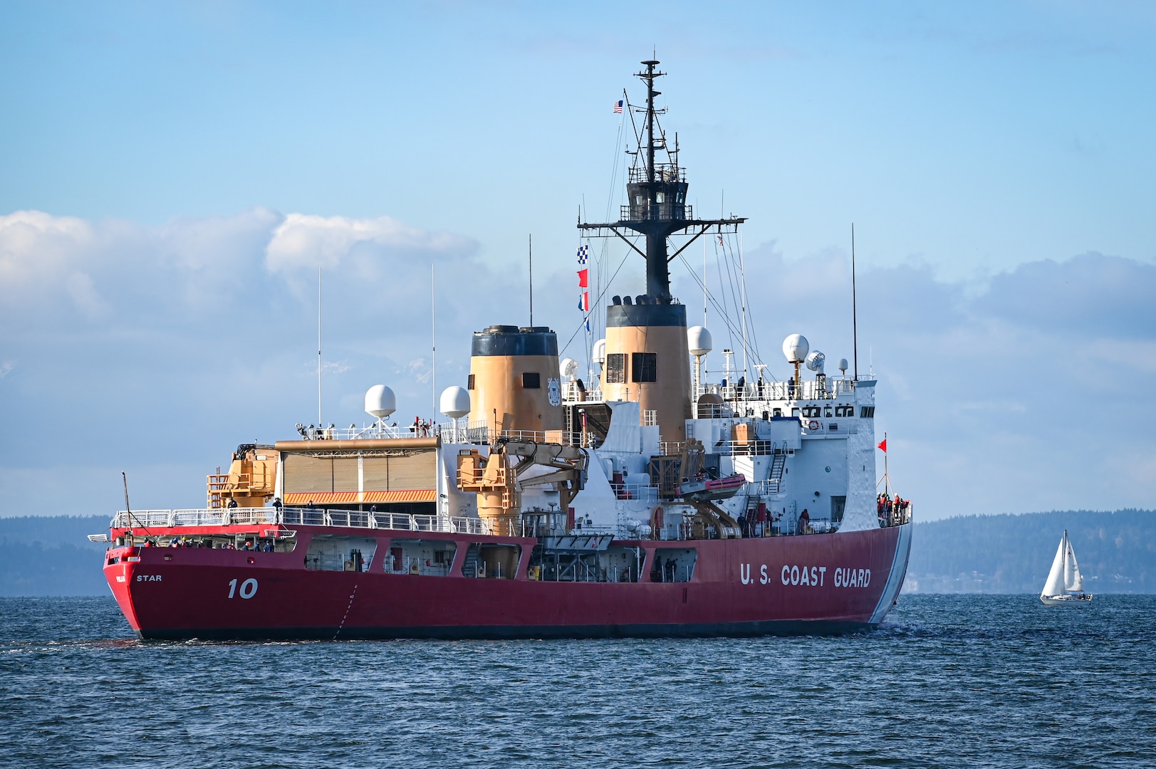 U.S. Coast Guard Cutter Polar Star (WAGB 10) transits across Elliott Bay after departing Base Seattle on Nov. 15, 2023. The crew are scheduled to assist with icebreaking operations near Antarctica in the coming months in support of Operation Deep Freeze. (U.S. Coast Guard photo by Petty Officer Steve Strohmaier)