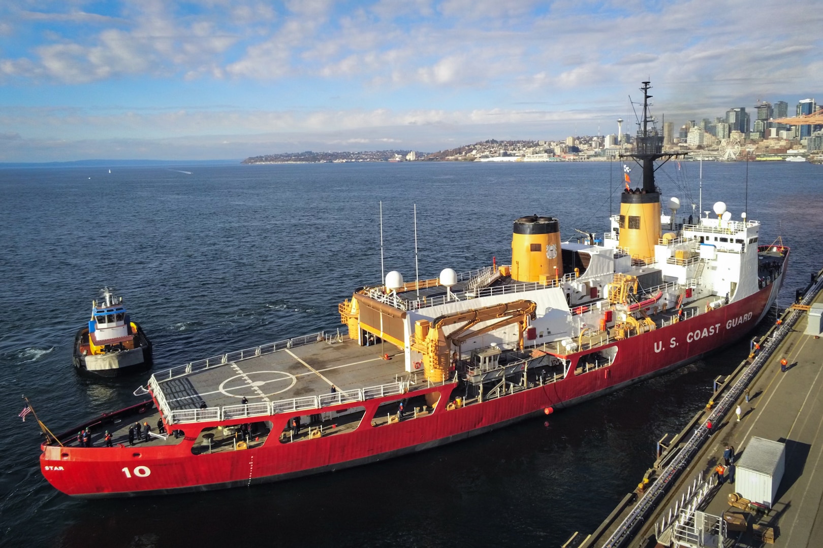 U.S. Coast Guard Cutter Polar Star (WAGB 10) begins to push away from the pier at Base Seattle as the crew departs on Nov. 15, 2023. The Polar Star is the Nation’s only operational heavy polar icebreaker and the only asset capable of providing access to both Polar Regions. (U.S. Coast Guard photo by Lt. Chris Butters)