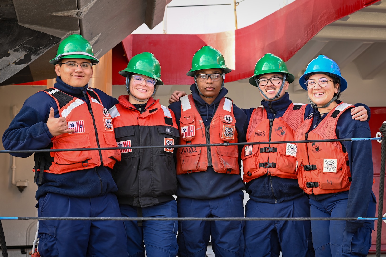 U.S. Coast Guard Cutter Polar Star's (WAGB 10) crew members deck department pose for a photo as the cutter begins to get underway from Base Seattle, Nov. 15, 2023. The crew is scheduled to deploy for several months in support of Operation Deep Freeze, a mission that enables the delivery of critical supplies to sustain the U.S. Antarctic Program’s year-round operations. (U.S. Coast Guard photo by Petty Officer Steve Strohmaier)