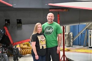 Brian and Brandy Stewart, 573rd Aircraft Maintenance Squadron, pose in front of an F-16 Fighting Falcon in depot maintenance at Hill Air Force Base, Utah. The aircraft technicians are this month's Ogden Air Logistics Complex featured employees. (U.S. Air Force photo by Cynthia Griggs)