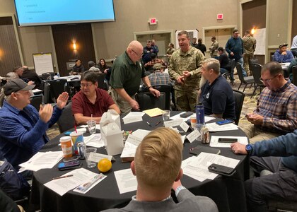 Multiple agencies take part in a group discussion during the Evergreen Spill Tabletop Exercise in Airway Heights, Wash., Nov. 8, 2023. This exercise tested the response of the Washington National Guard, Tribal emergency managers and state and federal agencies to a hypothetical hazardous waste spill on the Colville Indian Reservation.