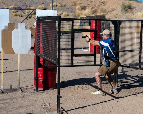 U.S. Air Force Tech. Sgt. Michael Schuerhoff, 49th Civil Engineer Squadron intelligence non-commissioned officer in charge, shoots at a moving target during a shooting competition at Rio Salado Sportsman’s Club in Mesa, Ariz., Nov. 10, 2023. Schuerhoff was accepted to and joined the USAF Action Shooting Team in 2021.