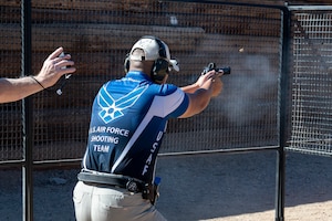U.S. Air Force Staff Sgt. Christian Magaling, 354th Fighter Squadron weapons technician, completes a course during a shooting competition at Rio Salado Sportsman’s Club in Mesa, Ariz., Nov. 10, 2023. The USAF Action Shooting Team competed on 17 different shooting courses during the competition.