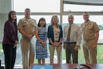 Jessica Williamson (center right) stands with Naval Surface Warfare Center, Carderock Division and Naval Sea Systems Command leadership at the Washington Navy Yard in August 2023 after being recognized with the Department of Navy Civilian Service Commendation Medal. From left: Operations Department Head Tamar Gallagher, Commanding Officer Capt. Matthew Tardy, NAVSEA Executive Director Gia Phan, SES, Jessica Williamson, Technical Director Lawrence Tarasek and former NAVSEA Commander Vice Adm. William Galinis.