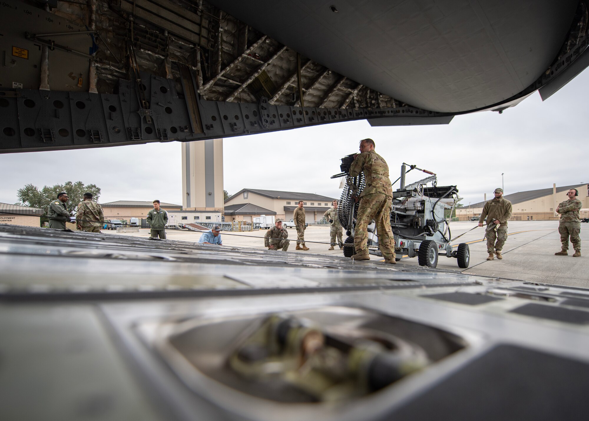 U.S. Air Force Airmen assigned to the 23rd Wing load an ammunition loading adapter onto a C-17 Globemaster III from the 437th Airlift Wing during exercise Mosaic Tiger 24-1 at Moody Air Force Base, Georgia, Nov. 13, 2023. The C-17 was bound for Avon Park Air Force Range, Florida, to enable Airmen to conduct live-fire reloading of A-10C Thunderbolt II aircraft participating in the readiness exercise. (U.S. Air Force photo by Master Sgt. Daryl Knee)