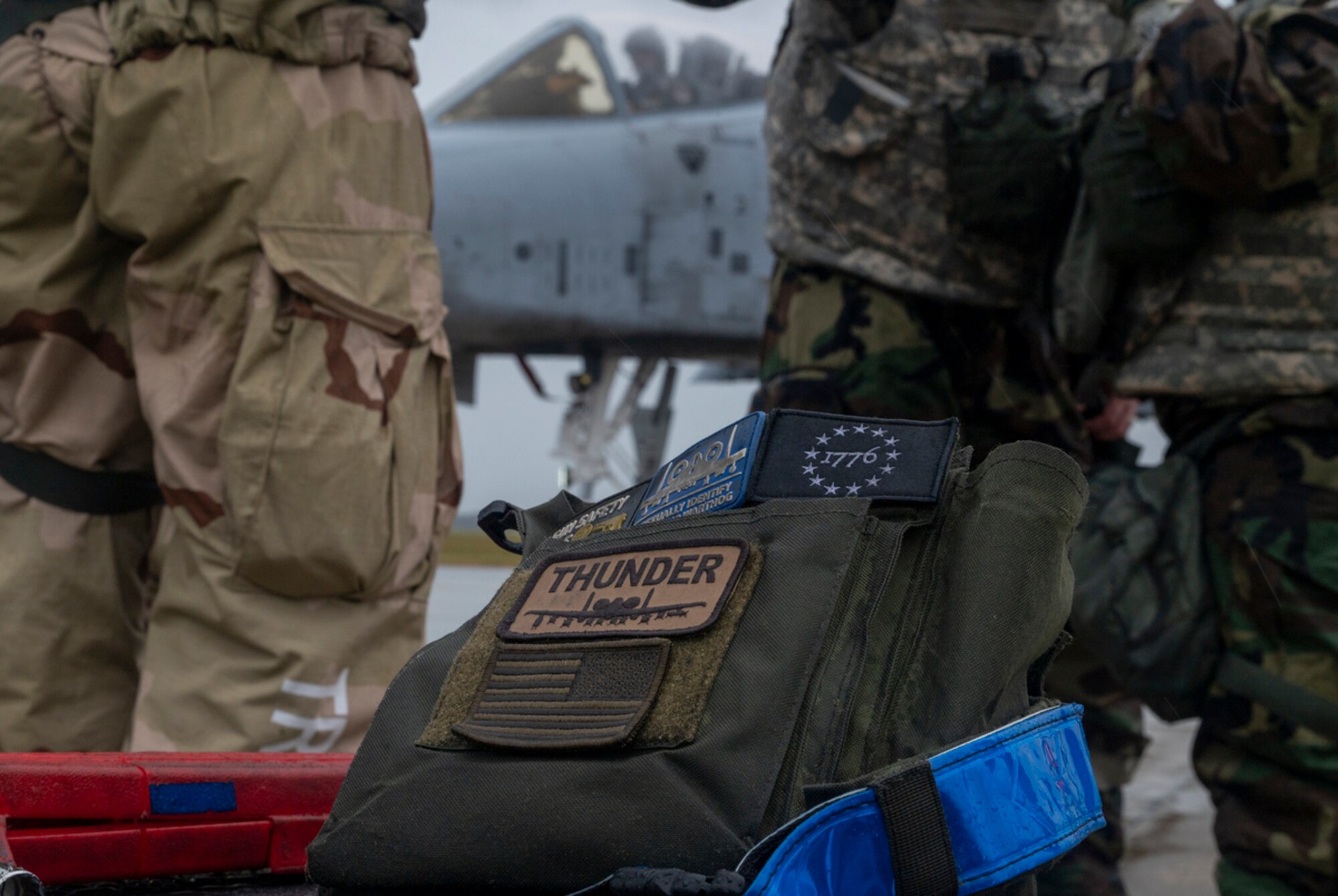 Rain-soaked crew chief’s pouch sits on a crate at Avon Park Air Force Range, Florida, Nov. 15, 2023. The less than ideal weather and bulky exercise protective gear further tested the multi-capable Airmen team on their speed and efficiency to relaunch the A-10C Thunderbolt IIs as fast as possible. (U.S. Air Force photo by Airman 1st Class Leonid Soubbotine)