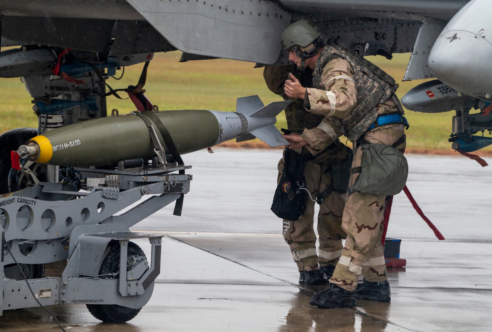 U.S. Air Force Staff Sgt. David Walker, 74th Fighter Generation Squadron weapons load team chief, guides the transport at Avon Park Air Force Range, Florida, Nov. 15, 2023. Mosaic Tiger 24-1 is a readiness exercise designed to test the 23rd Wing's ability to generate airpower at austere and dispersed locations while combating degraded communications. (U.S. Air Force photo by Airman 1st Class Leonid Soubbotine)