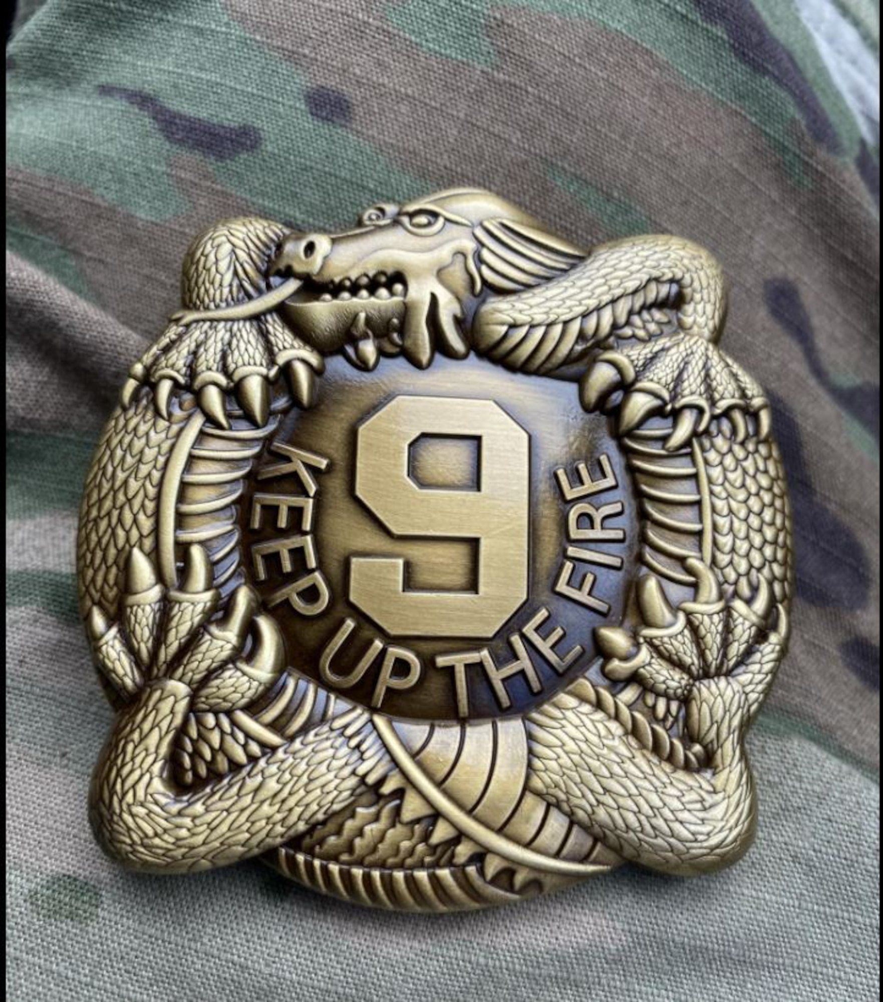 Finishers of the Manchu Mile, a 25-mile ruck march through the training areas on Fort Carson, received a decorative "Keep Up the Fire" belt buckles after crossing the finish line Oct. 27, 2023. The ruck march paid homage to the 4th Battalion, 9th Infantry Regiment’s 87-mile forced march during the Chinese “Boxer Rebellion” in the early 1900s. (Courtesy photo provided by U.S. Space Force Sgt. Stephen Lemmons)