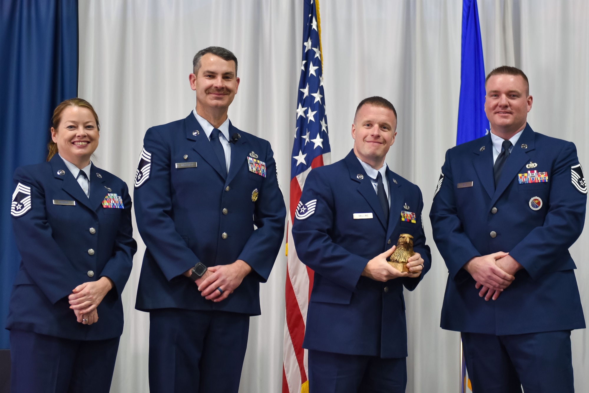 U.S. Air Force Technical Sgt. Tyler Mullins receives the academic achievement award during Non-Commissioned Officer Academy class 24-1 graduation, November 15, 2023, at the Training and Education Center (TEC), McGhee Tyson Air National Guard Base, Tenn. The Lankford Enlisted Professional Military Education Center is one of three divisions of the TEC that accommodates 2,000 service members annually from the Total Force, Coast Guard, and partner nations. (Photo by Master Sgt. Regina Young)