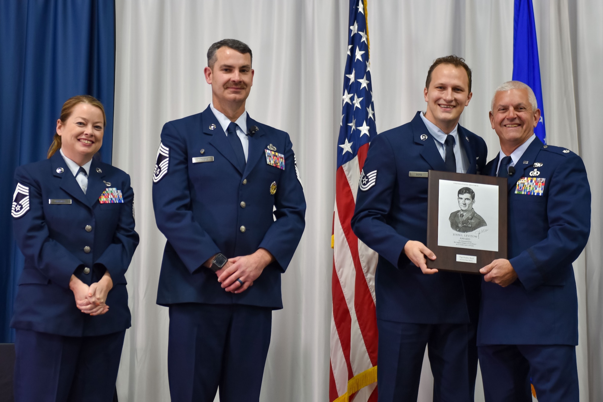 U.S. Air Force Technical Sgt. Bradley Boyd, top graduate, receives the John L. Levitow award during Non-Commissioned Officers Academy class 24-1 graduation, November 15, 2023, at the Training and Education Center (TEC), McGhee Tyson Air National Guard Base, Tenn. The Lankford Enlisted Professional Military Education Center is one of three divisions of the TEC that accommodates 2,000 service members annually from the Total Force, Coast Guard, and partner nations. (Photo by Master Sgt. Regina Young)