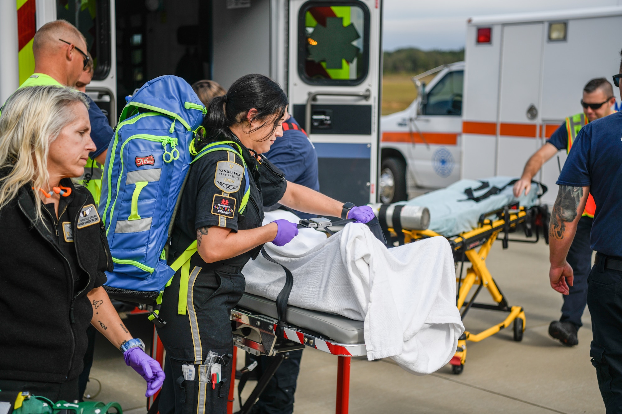 An exercise patient is unloaded from an Arnold Air Force Base Fire and Emergency Services ambulance to be loaded for transport onto a Vanderbilt LifeFlight medical helicopter during an active shooter exercise conducted Sept. 28, 2023, at Arnold AFB, Tenn. (U.S. Air Force photo by Keith Thornburgh)