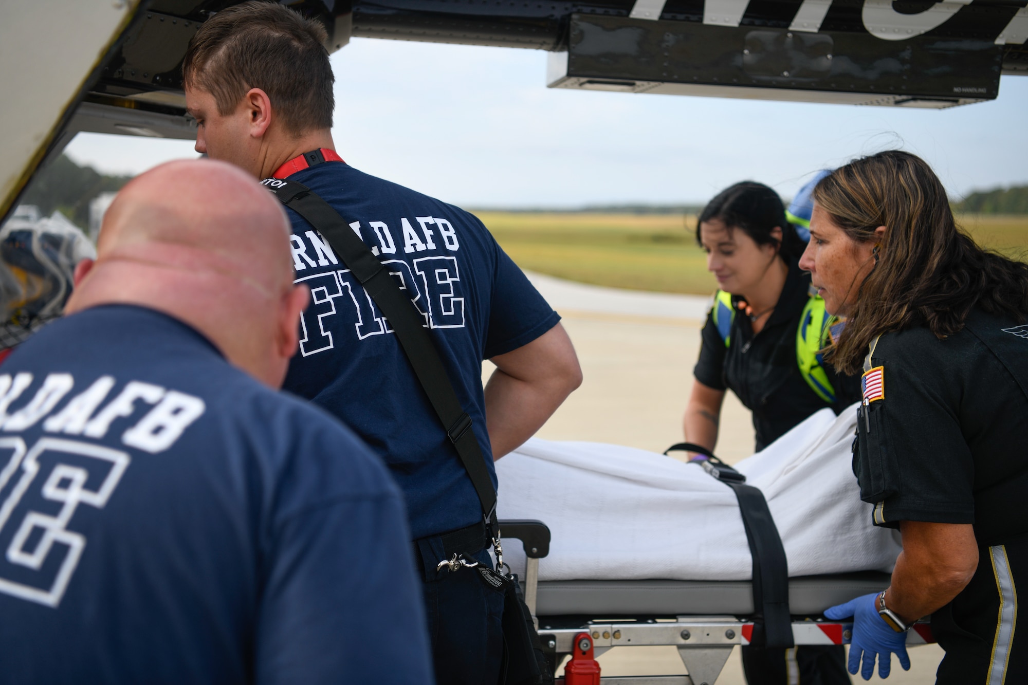 An exercise patient is loaded for transport onto a Vanderbilt LifeFlight medical helicopter during an active shooter exercise conducted Sept. 28, 2023, at Arnold AFB, Tenn. (U.S. Air Force photo by Keith Thornburgh)