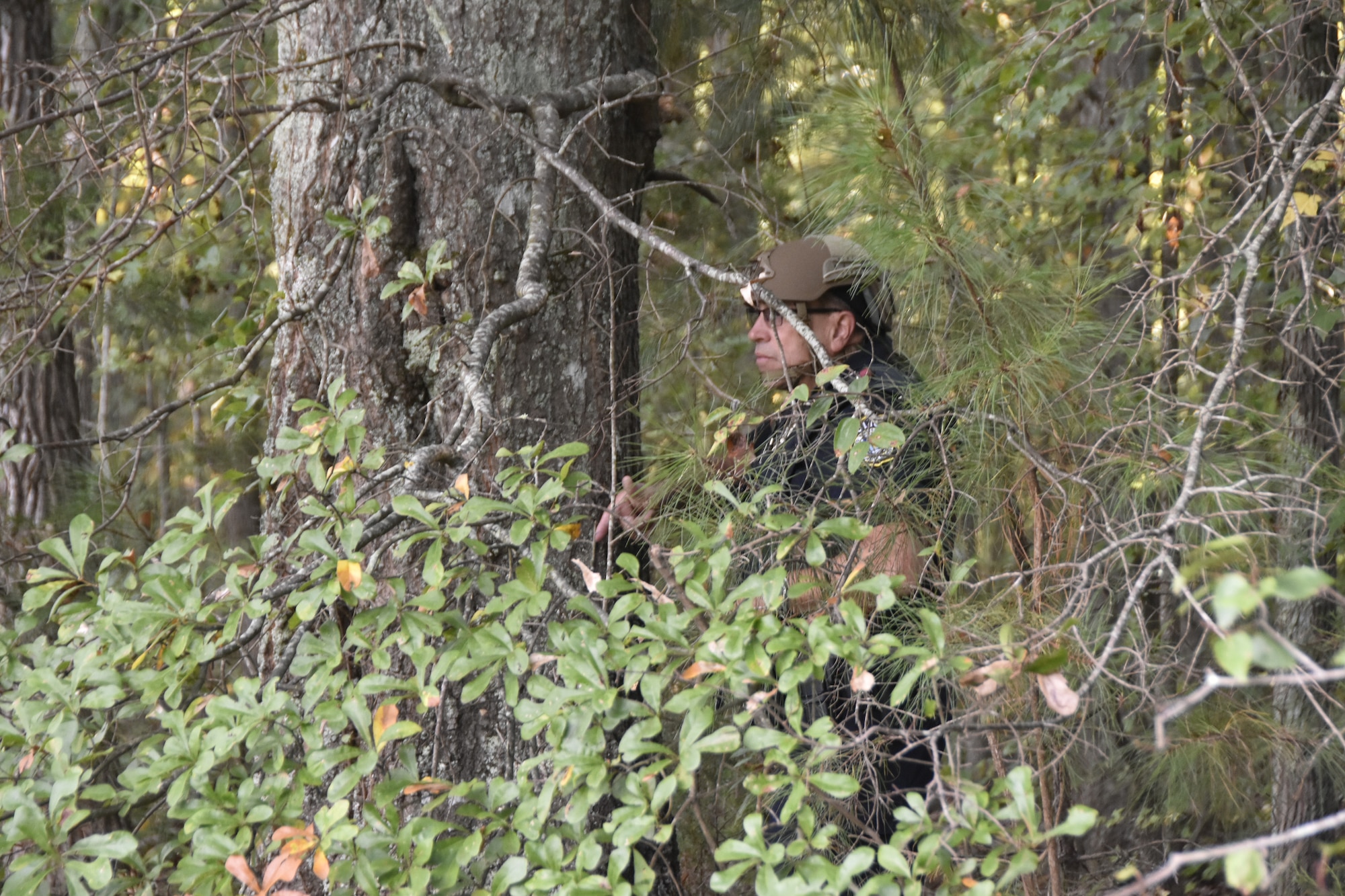 A member of the Arnold Air Force Base Security Forces team keeps watch on the building where a simulated active shooting incident occurred while personnel with the Coffee County Sheriff’s Department perform a sweep of the facility. The active shooter exercise was conducted Sept. 28, 2023, at Arnold AFB, Tenn. (U.S. Air Force photo by Bradley Hicks)