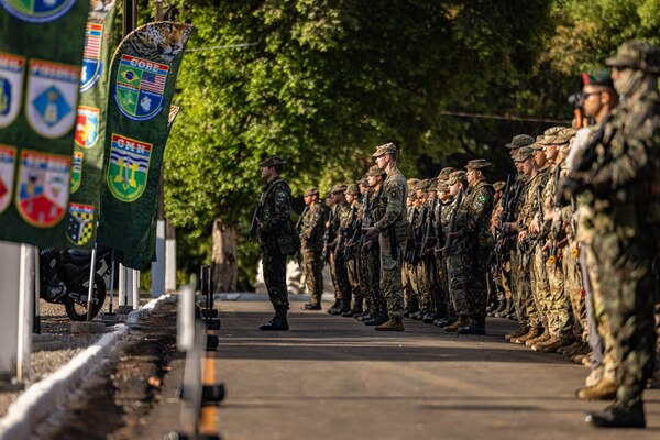 U.S. Army Soldiers assigned to 1st Battalion, 26th Infantry Regiment, 2nd Brigade Combat Team, 101st Airborne Division (Air Assault), 1st Security Forces Assistance Brigade, 7th Group Special Forces and Brazilian army soldiers assigned to 52nd Battalion, 23rd Infantry Brigade participate in the closing ceremony of Exercise Southern Vanguard 24 in Oiapoque, Brazil, Nov. 16, 2023. Southern Vanguard, an annual bilateral exercise which rotates between partner nations in the U.S. Southern Command area of responsibility, is designed to enhance partner interoperability between the U.S. and partner nation forces. (U.S. Army photo by Spc. Joshua Taeckens)