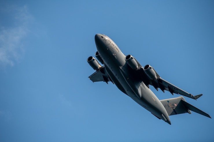 A C-17 Globemaster III flies over Trustmark Park before a Mississippi Braves baseball game.