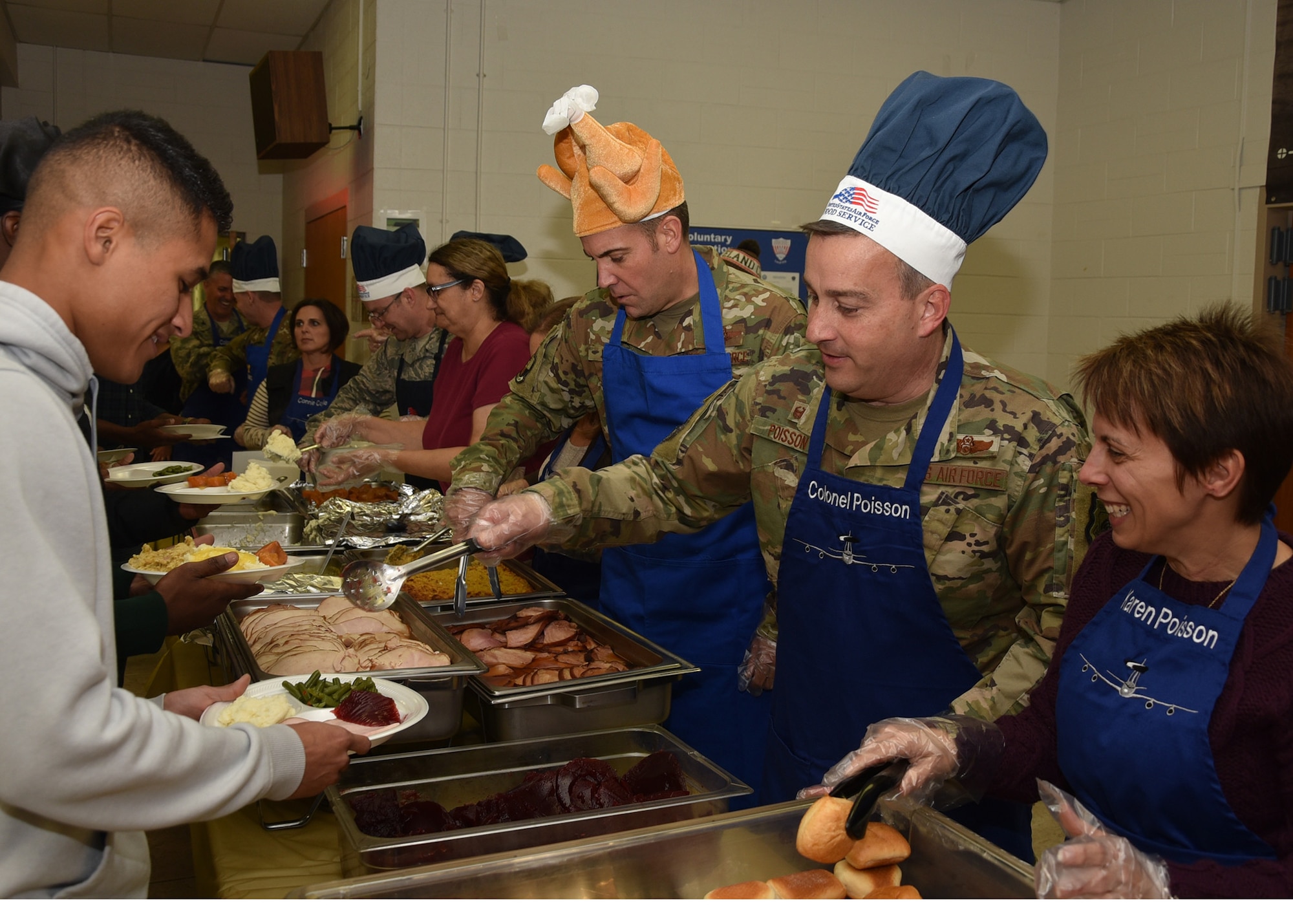 Commanders serve Thanksgiving dinner.