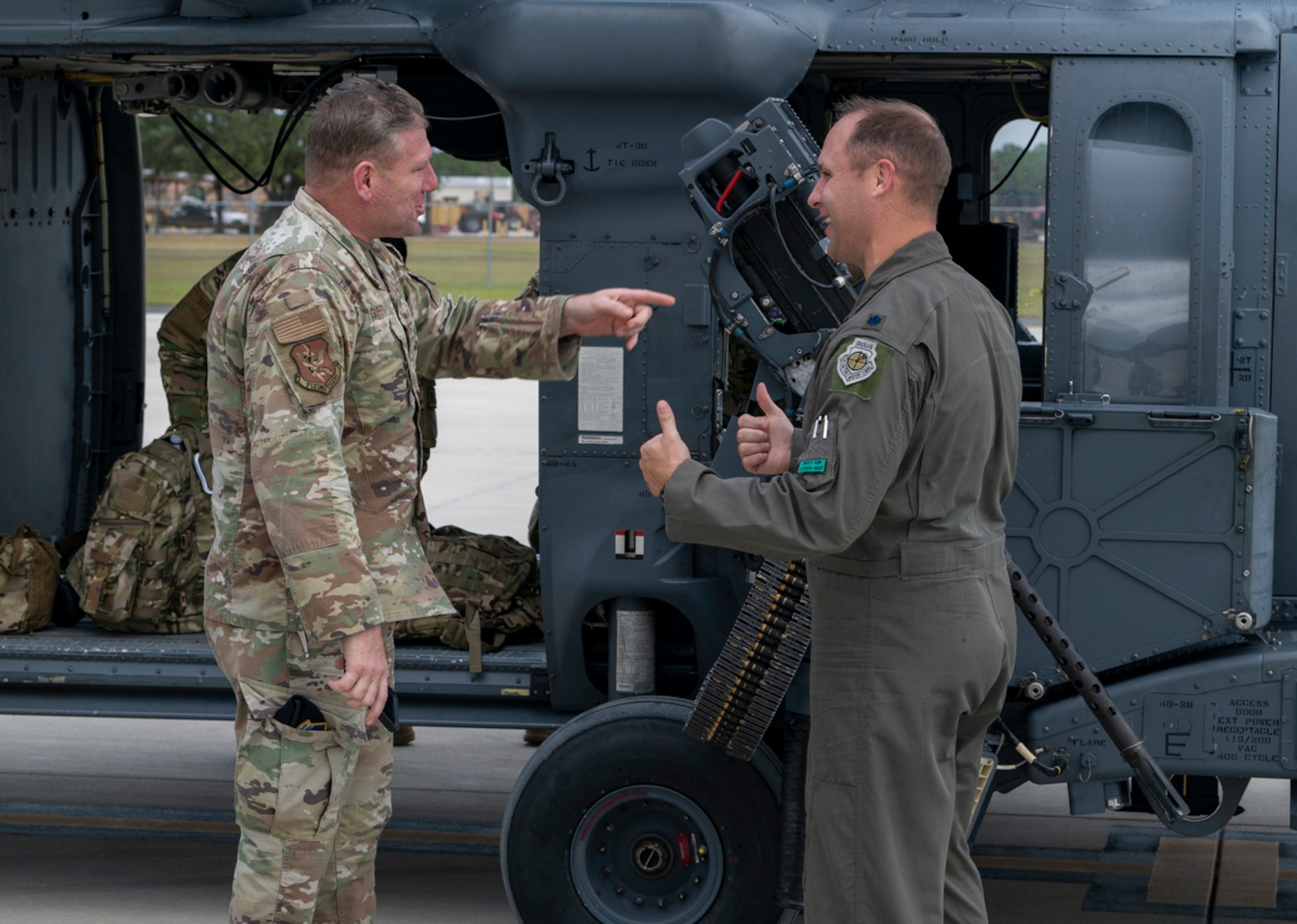 U.S. Air Force Chief Master Sgt. Justin Geers, 23rd Wing command chief, left, chats with U.S. Air Force Lt. Col. Thaddeus Ronnau, 41st Rescue Squadron commander, during exercise Mosaic Tiger 24-1 at Avon Park Air Force Range, Florida, Nov. 16, 2023. Mosaic Tiger 24-1 is a weeklong exercise designed to test the 23rd Wing's ability to generate airpower at austere or dispersed locations while combating degraded communications. (U.S. Air Force photo by Airman 1st Class Leonid Soubbotine)