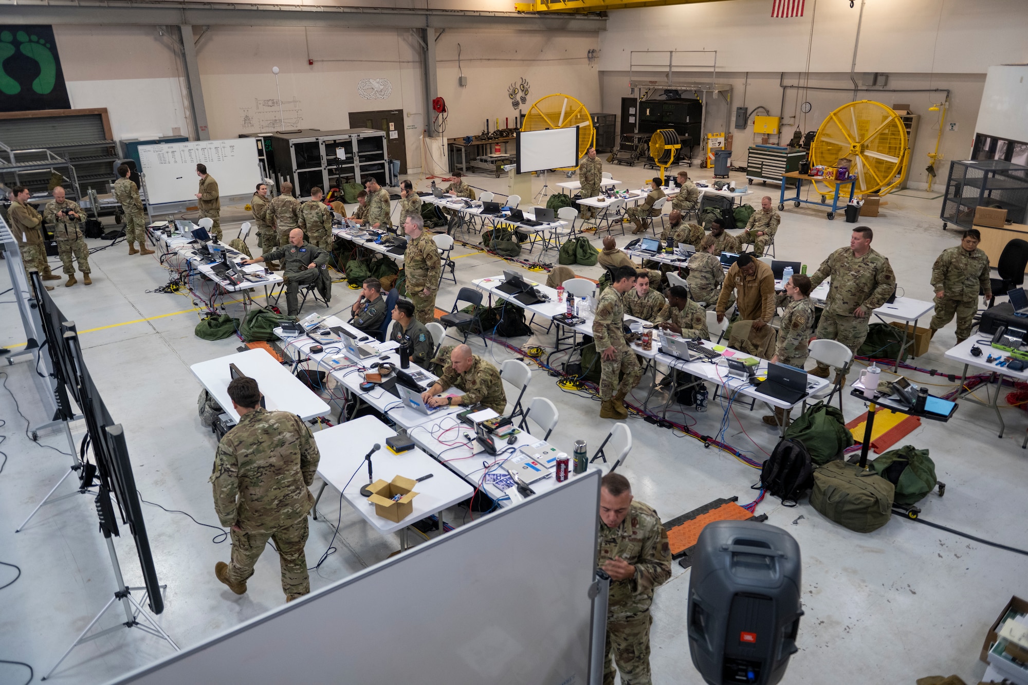 U.S. Air Force Airmen assigned to the 23rd Wing operate in a Wing Operations Center during exercise Mosaic Tiger 24-1 at Moody Air Force Base, Georgia, Nov. 15, 2023. Wing Operations Centers are comprised of representatives from many operational elements who keep the deployed commander informed. (U.S. Air Force photo by Senior Airman Deanna Muir)