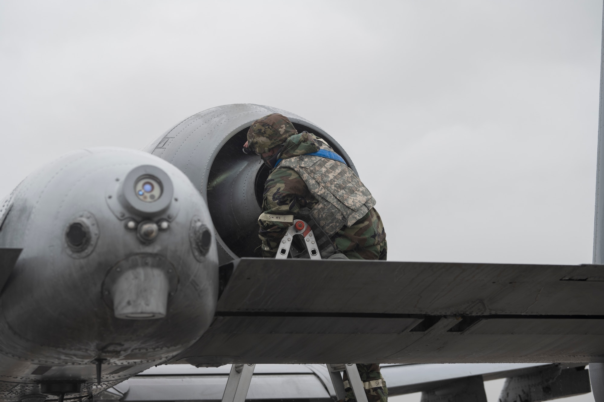 U.S. Air Force Senior Airmen Michael Shepel, 74th Fighter Generation Squadron engine specialist, completes an inlet and exhaust inspection on an A-10C Thunderbolt II at Avon Park Air Force Range, Florida, Nov. 15, 2023. Once landed, aircraft are given a thorough inspection to check for any damage or debris. (U.S. Air Force photo by Senior Airman Rachel Coates)