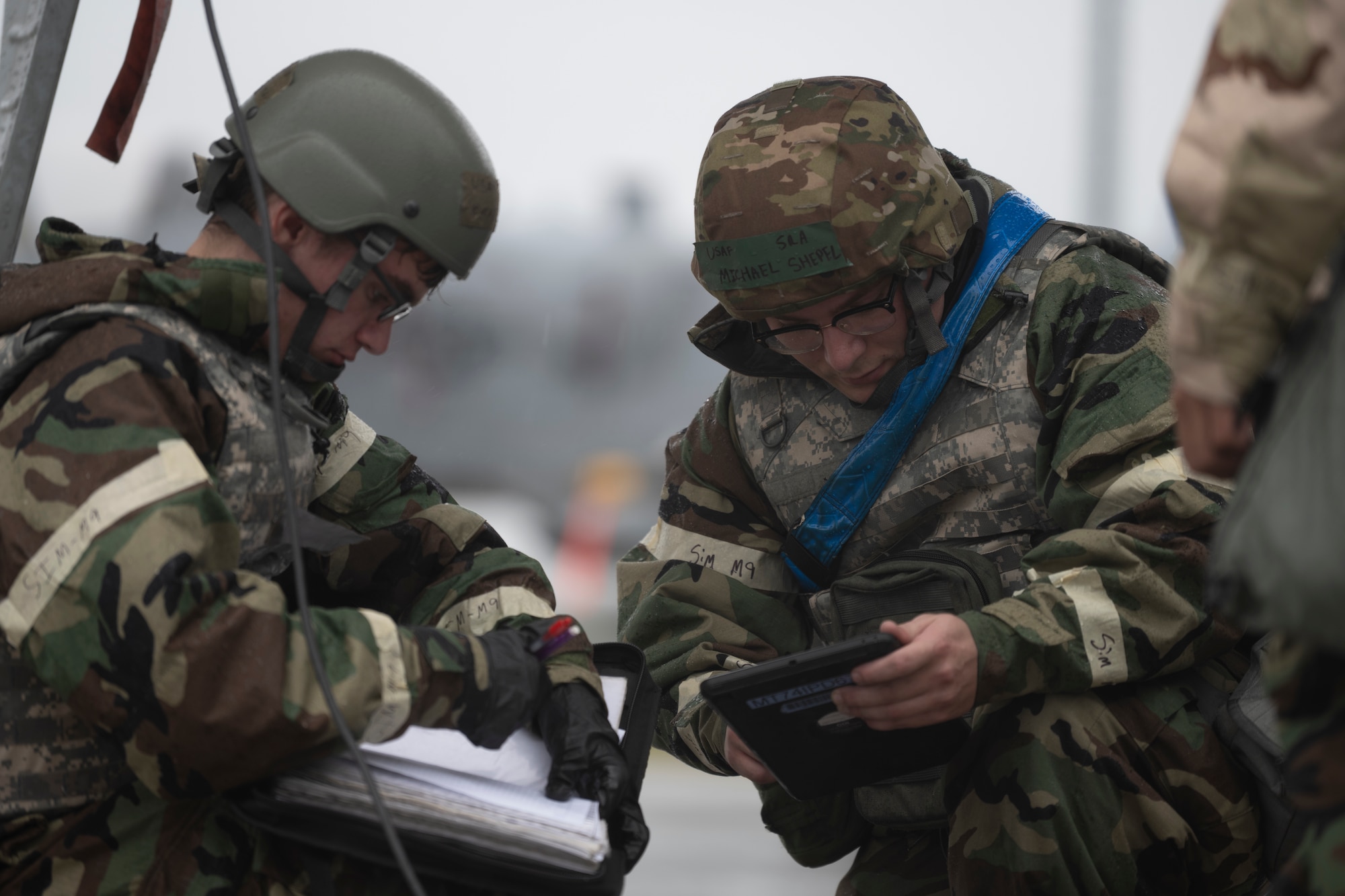 U.S. Air Force Airmen assigned to the 74th Rescue Generation Squadron don Mission Oriented Protective Posture (MOPP) gear during exercise Mosaic Tiger 24-1 at Avon Park Air Force Range, Florida, Nov. 15, 2023. This exercise tested the ability for Airmen to rapidly execute their mission while wearing MOPP gear. (U.S. Air Force photo by Senior Airman Rachel Coates)