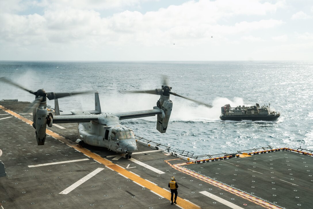 A U.S. Marine Corps MV-22B Osprey attached to Marine Medium Tiltrotor Squadron (VMM) 165 (Reinforced), 15th Marine Expeditionary Unit, conducts a touch-and-go landing aboard the amphibious assault ship USS Boxer (LHD 4) in the Pacific Ocean, Nov. 7, 2023. The 15th MEU is currently embarked aboard the Boxer Amphibious Ready Group conducting integrated training and routine operations in U.S. 3rd Fleet. (U.S. Marine Corps photo by Cpl. Amelia Kang)