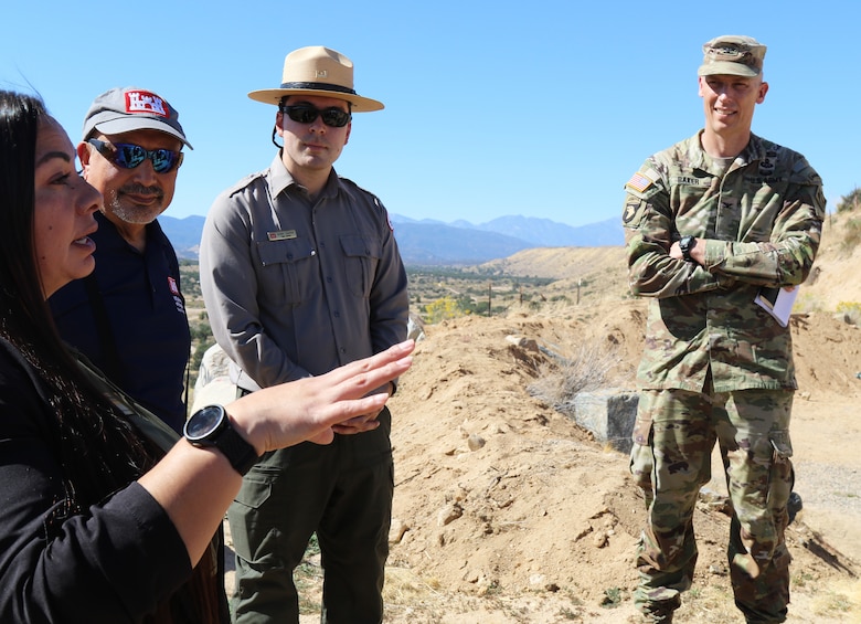 Col. Andrew Baker, LA District commander, right, Henry Csaposs, LA District park ranger, center, and Jon Rishi, LA District biologist, second from left, listen to Sonia Miranda with U.S. Representative Jay Obernolte’s office, left, speak during an Oct. 17 tour of the Mojave River Dam in Hesperia, California.