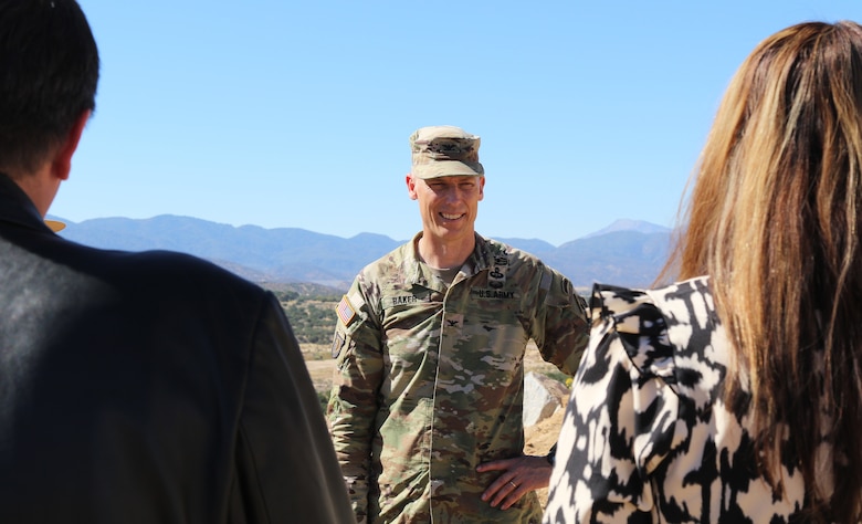 Col. Andrew Baker, LA District commander, speaks to representatives with several agencies during an Oct. 17 tour at the Mojave River Dam in Hesperia, California. The group toured the dam following a signing ceremony acknowledging a Cooperative Partnership Agreement between the Corps and the Southern California Mountains Foundation.