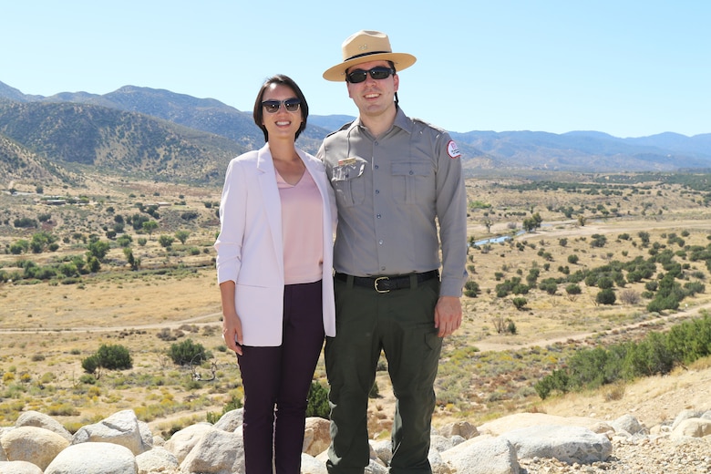 Henry Csaposs, LA District park ranger, right, and Connie Chan Le, former LA District park ranger, left, pose for a picture in front of Mojave River Dam Oct. 17 in Hesperia, California. Both Csaposs and Chan-Le were present for a signing ceremony acknowledging the Cooperative Partnership Agreement between the LA District and the Southern California Mountains Foundation. The duo worked for two years with other agencies on the agreement and were instrumental in getting the agreement to fruition.