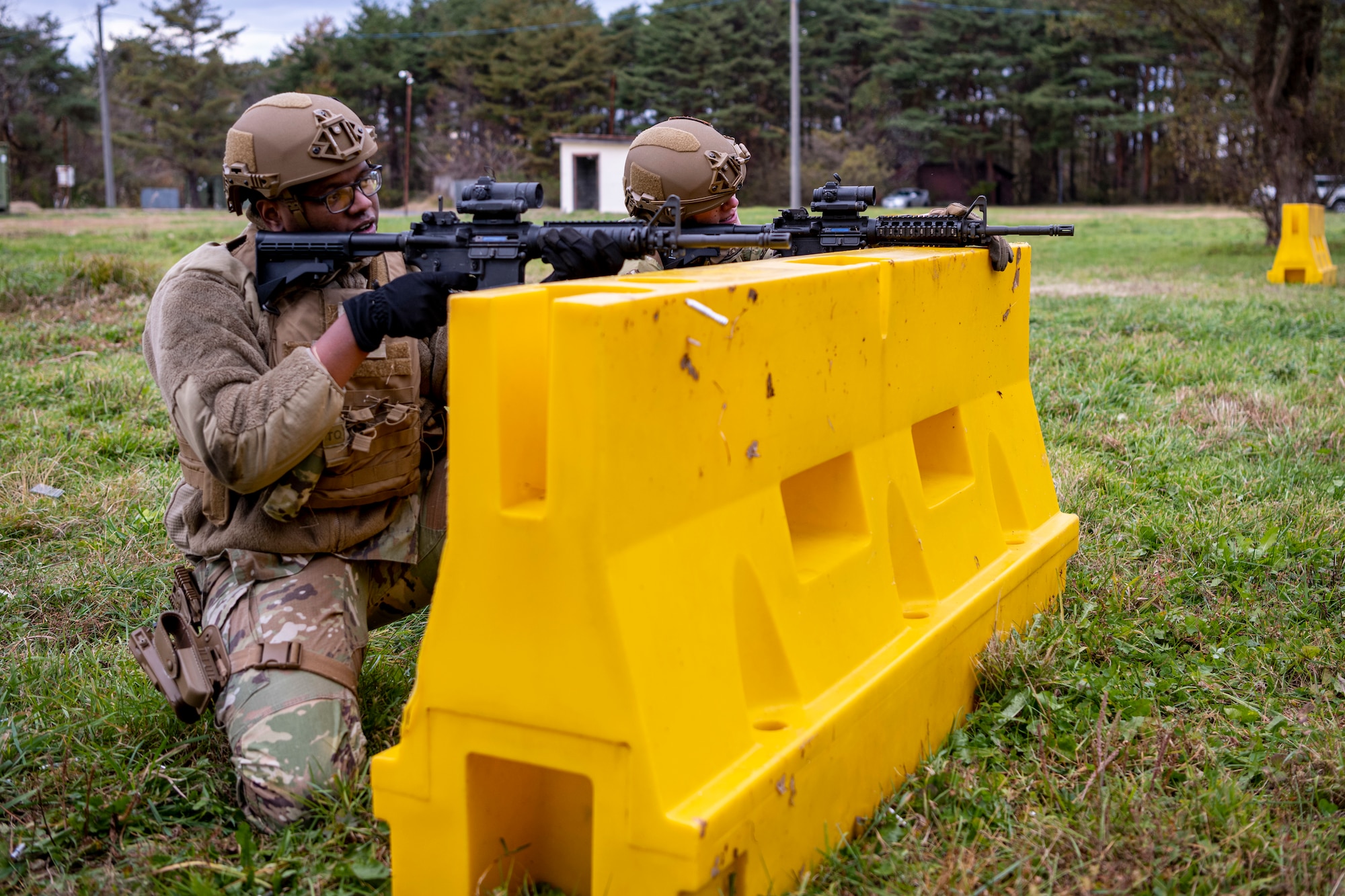 Service member aim down his sights.