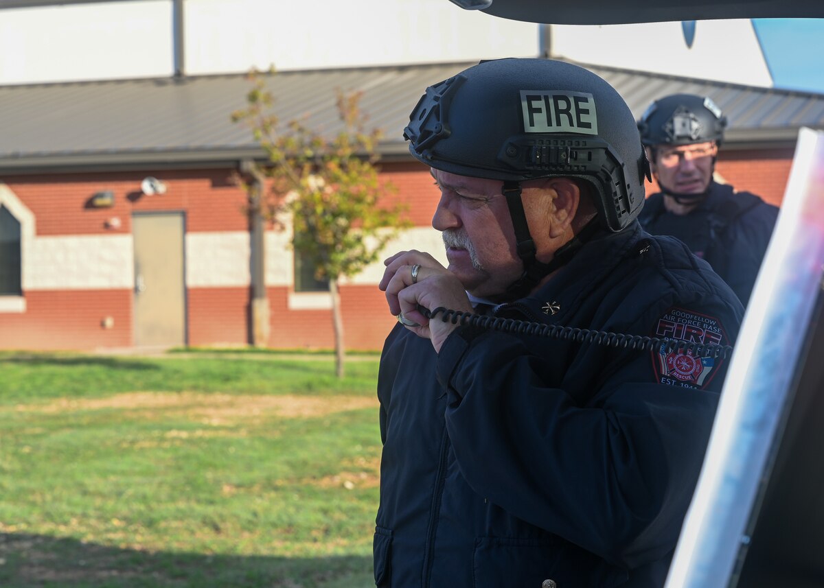 Darnel Drost, Goodfellow Air Force Base Fire Department operations officer, communicates with the Emergency Operations Center during an exercise at Goodfellow Air Force Base, Texas, Nov. 16, 2023. Base personnel coordinated responses, procedures and communication protocols. (U.S. Air Force photo by Airman 1st Class Zach Heimbuch)